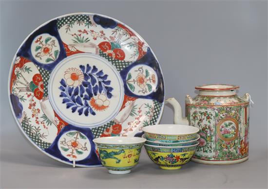 Four Chinese rice bowls, a Cantonese famille rose teapot and an Imari dish dish diameter 31cm